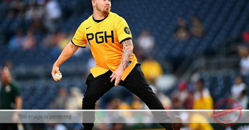 Pirates fan who fell from stands throws out first pitch