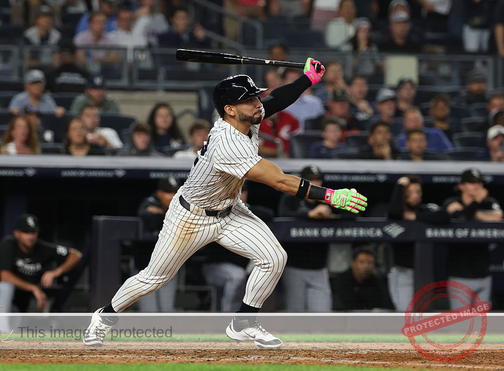 Yankees rally past White Sox 3-2, clinch playoff berth and close within 1 game of Toronto in AL East